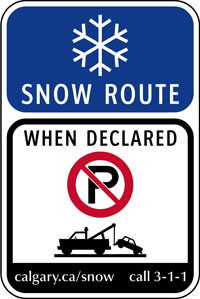 A photo of a snow route sign.